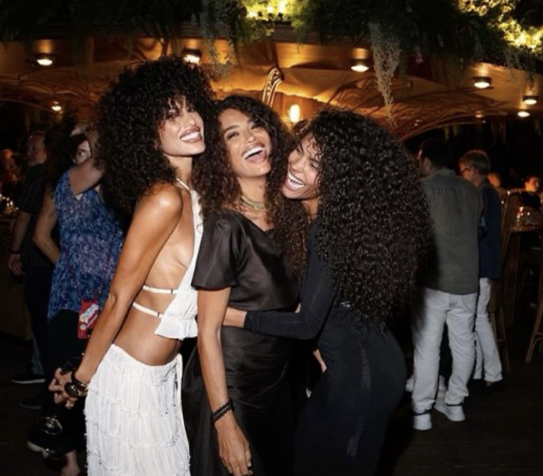 Friends laughing together at a night venue