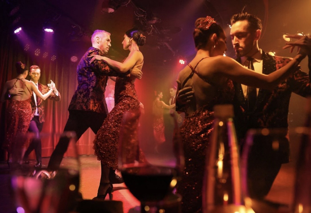 Tango showcase in red sequined gowns