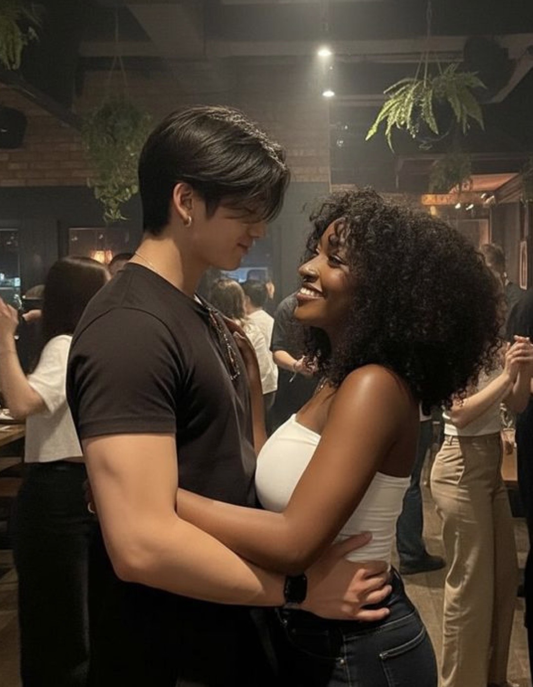 Couple in a close bachata embrace