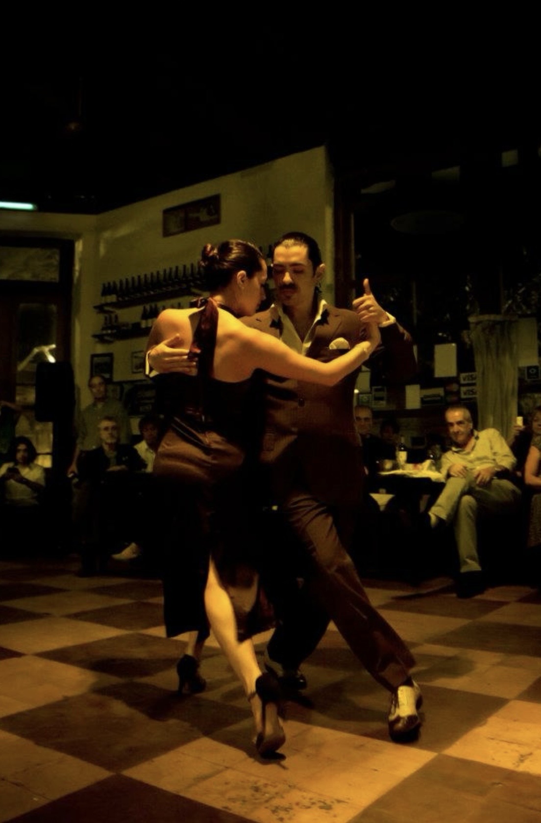 Argentine tango couple on checkered floor