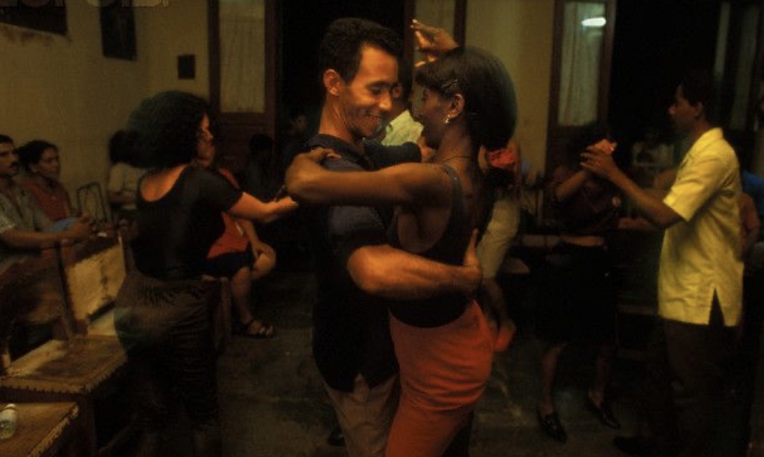 Couple dancing salsa in a Cuban bar