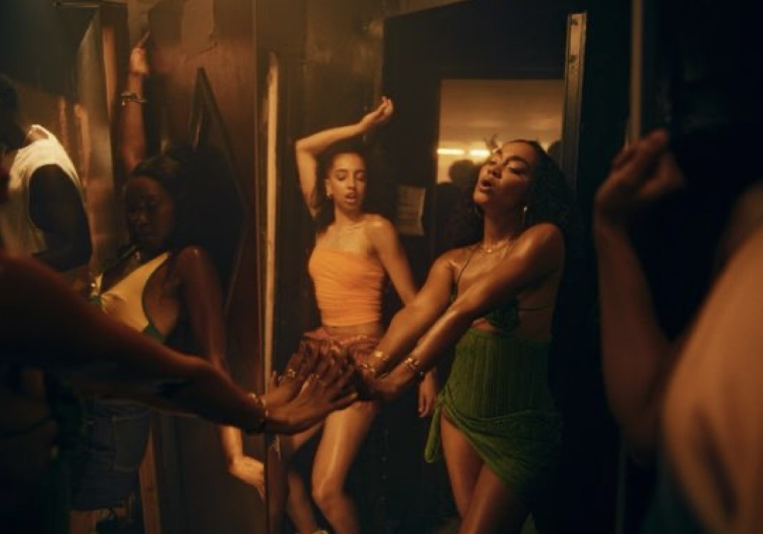 Dancers in a candlelit doorway