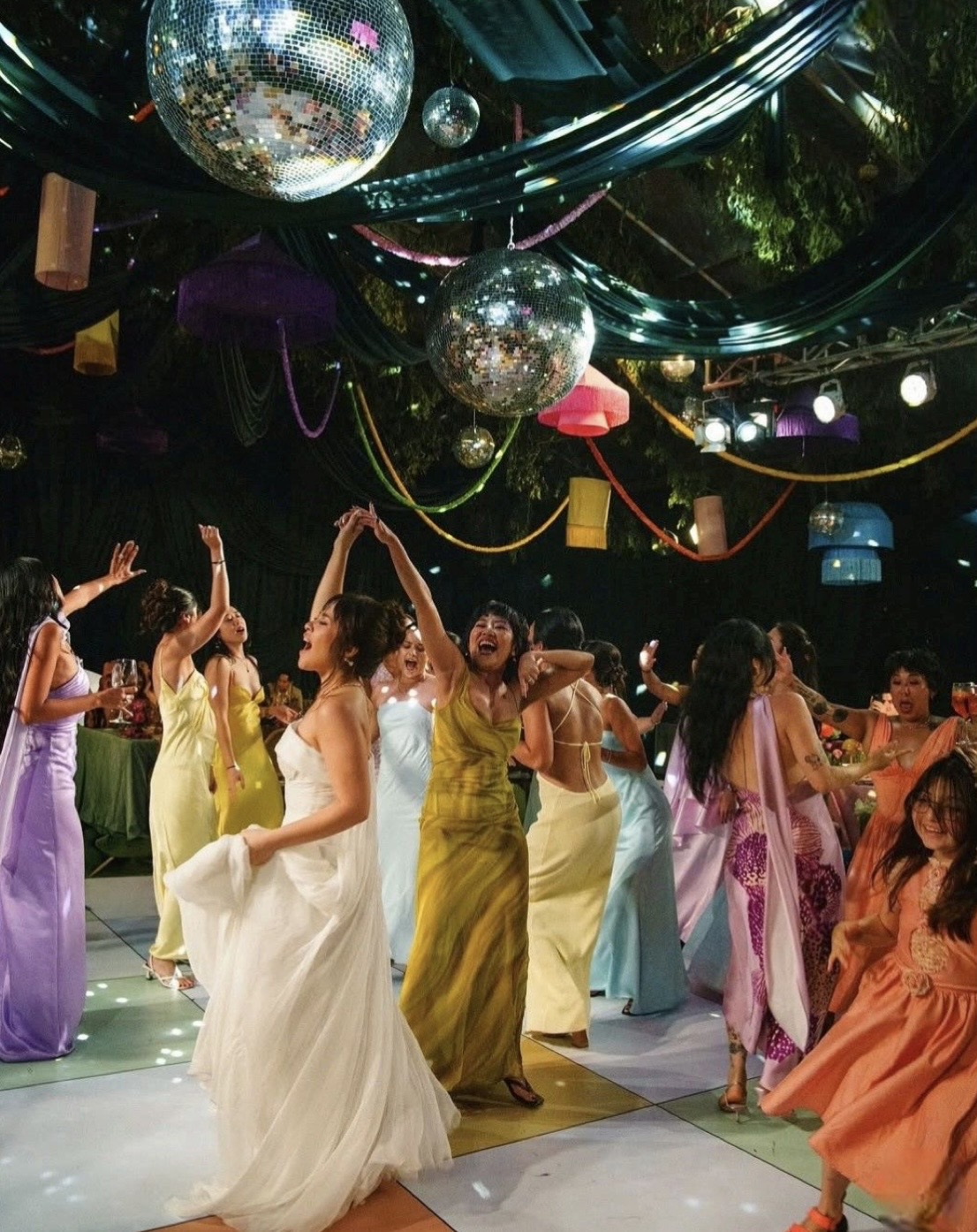 Joyful dance floor under disco balls