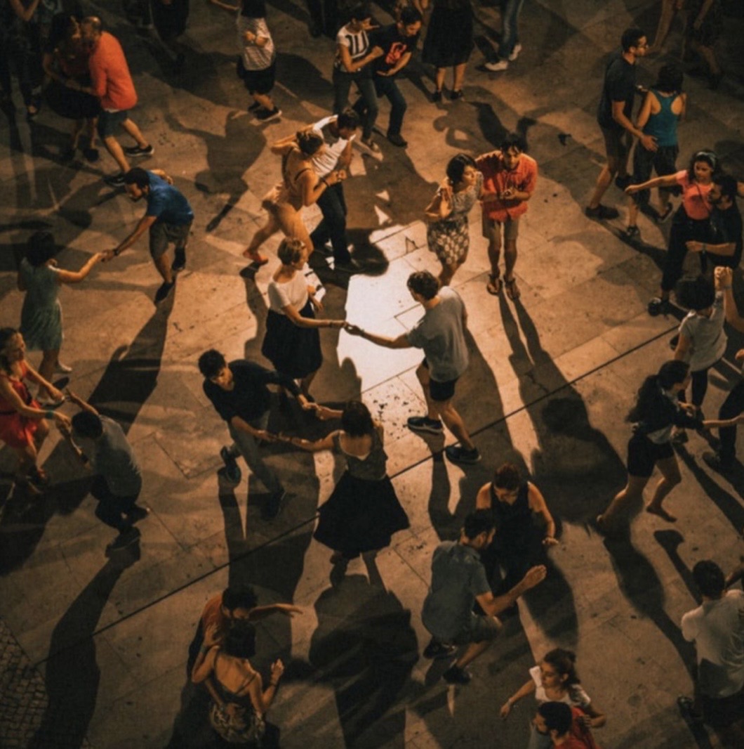 Overhead view of a vibrant outdoor night social dance
