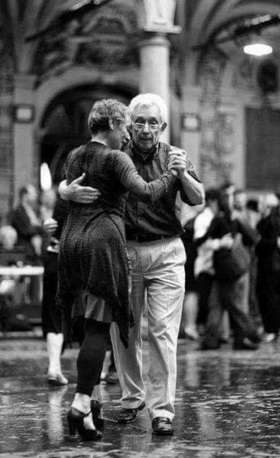 Couple tango in a plaza